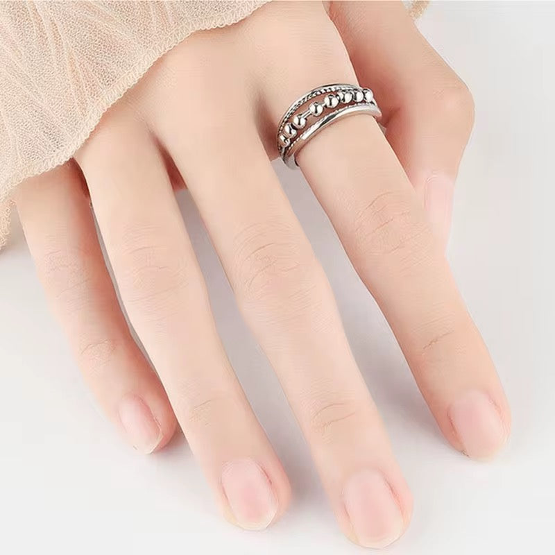 Anillo de bolitas anti-estrés plateado