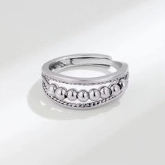 Anillo de bolitas anti-estrés plateado